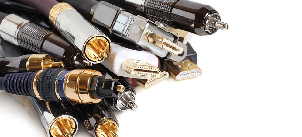 Close-up of audio and video cables with HDMI and RCA connectors, AV wiring accessories for home theater and professional media setup