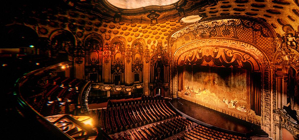 Ornate historic theater interior with grand stage and seating, performing arts venue architecture and event space setting