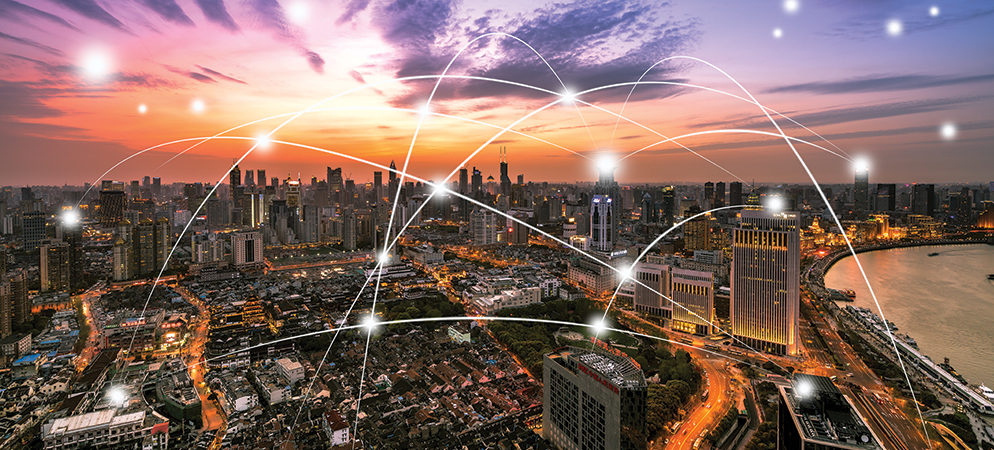 Smart city skyline at sunset with network connection lines overlay, representing IoT connectivity, digital infrastructure, and urban technology innovation
