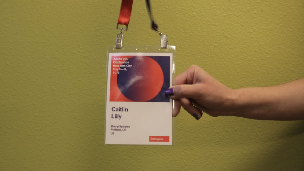 Image of a conference tag with the name Caitlin Lilly on it.