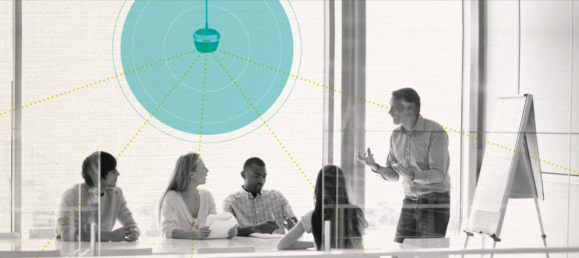 Meeting room with ceiling speaker coverage diagram overlay, showing audio distribution for conference call and clear sound in modern office.