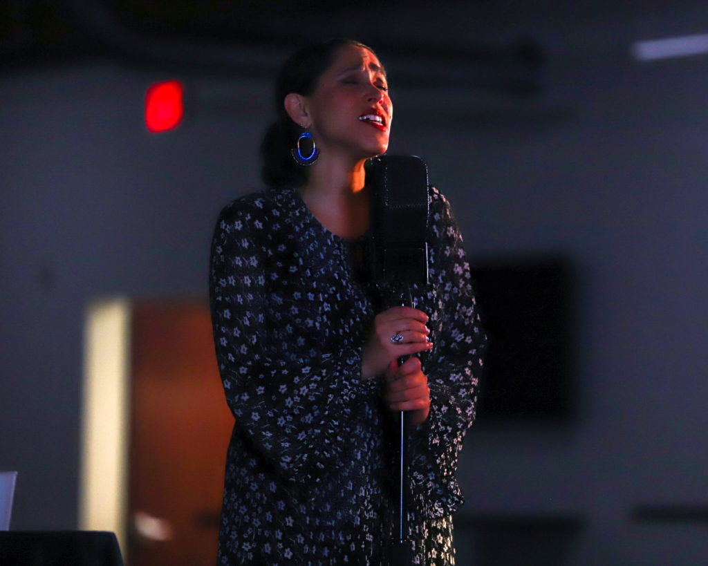 Image of China Forbes singing at a microphone