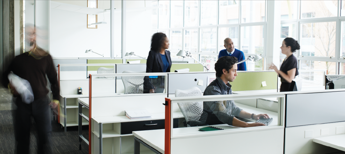 Modern open office with cubicles and coworkers collaborating, bright workspace design for team productivity and workplace communication