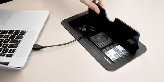 Image of Biamp EasyConnect connecting to a laptop on a table.