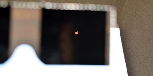 Image of the solar eclipse though some solar glasses.
