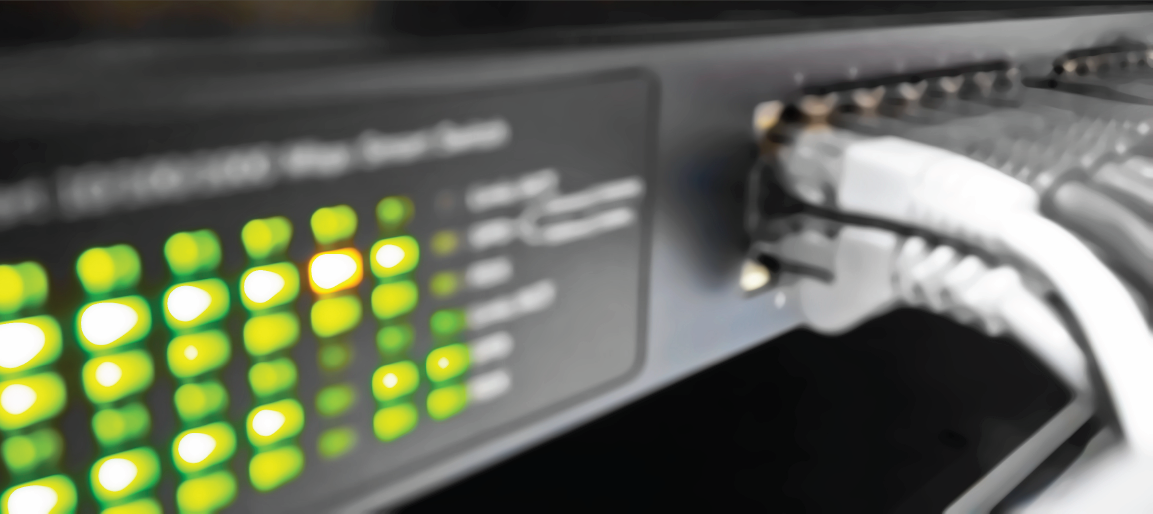 Close-up of network switch with Ethernet cables and glowing LED status lights, data center connectivity and IT infrastructure hardware.