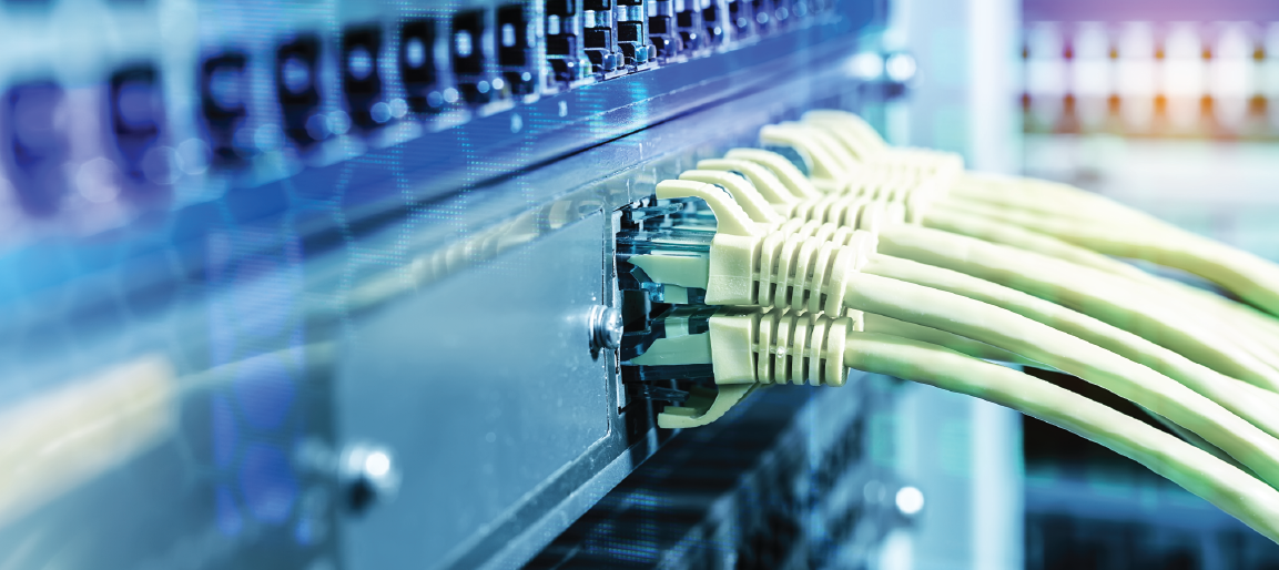 Close-up of Ethernet cables plugged into network switch ports in server rack, data center networking hardware and IT infrastructure connectivity.