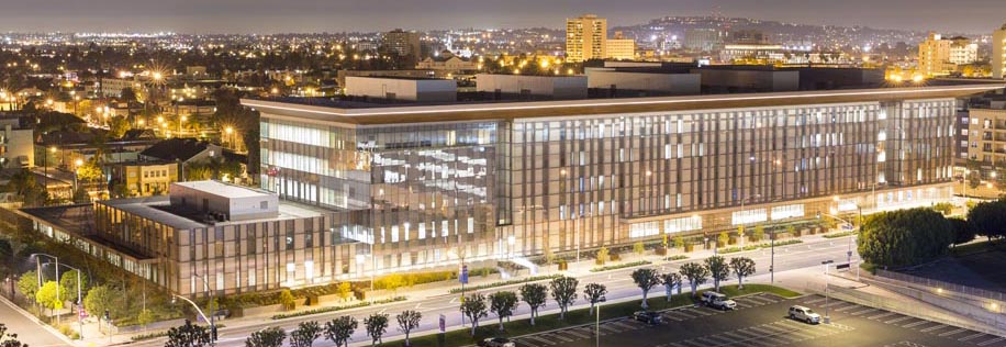 Modern Courthouse building at night with illuminated windows and city skyline, commercial architecture exterior and corporate campus scene