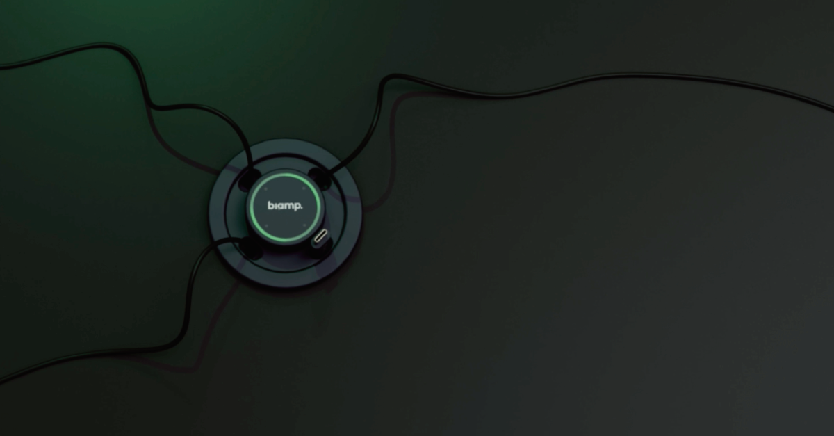 Biamp tabletop conference microphone with illuminated ring and connected cables for meeting room audio capture and collaboration