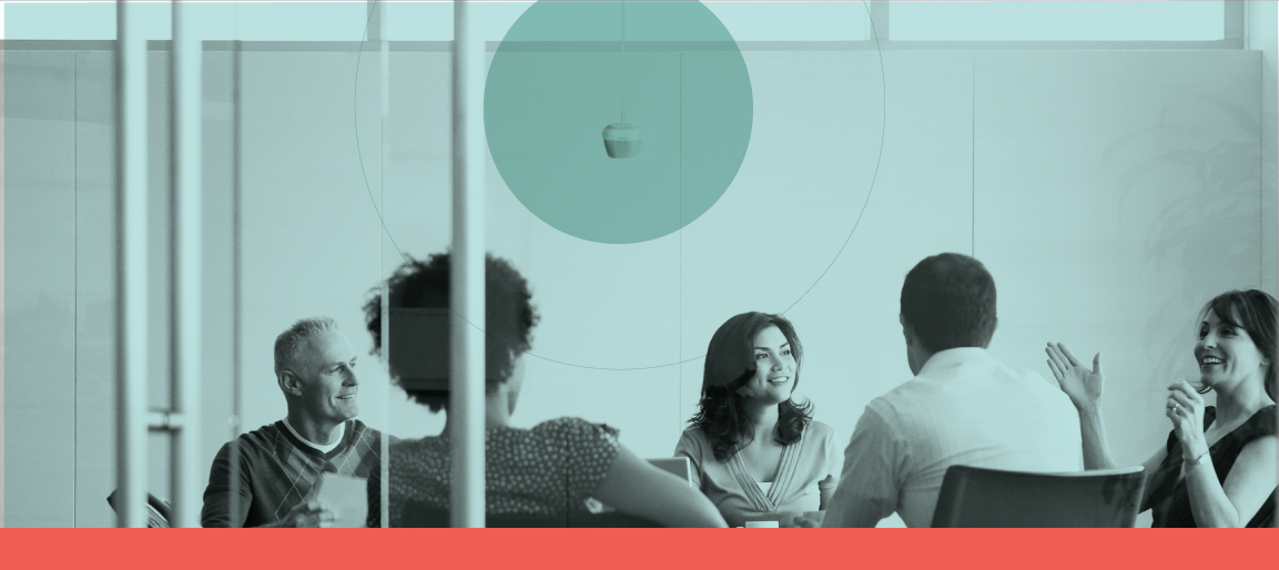 Team meeting in glass conference room with ceiling speaker coverage overlay, demonstrating clear audio distribution for modern collaboration spaces.