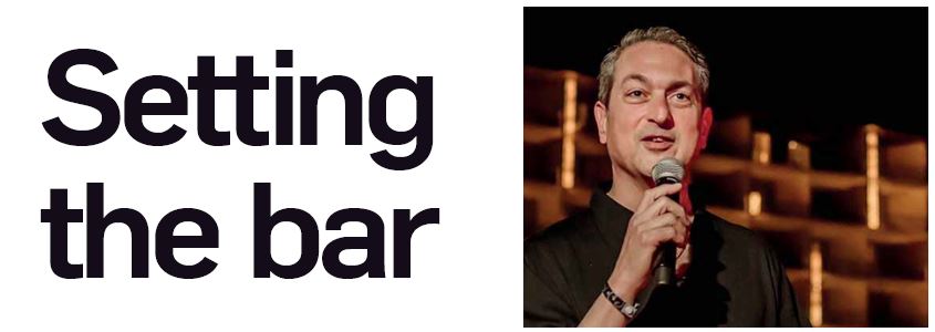 Setting the bar banner with speaker holding microphone on stage, presentation and keynote event graphic