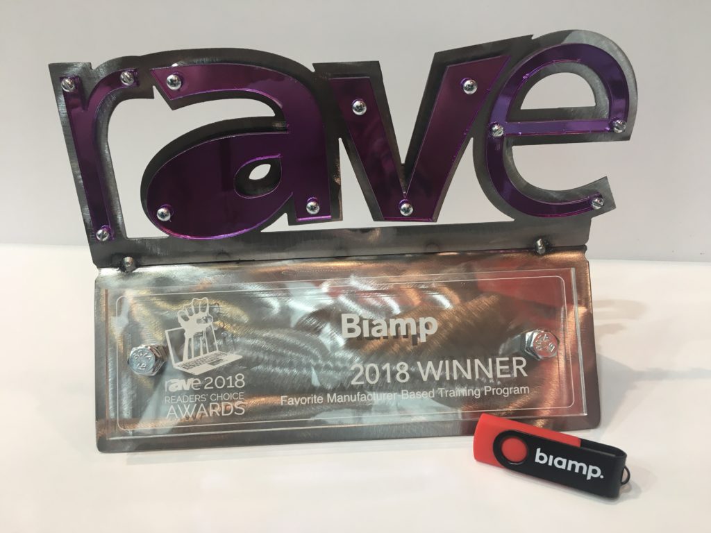 Image of the 2018 rAVe award and a Biamp USB stick.
