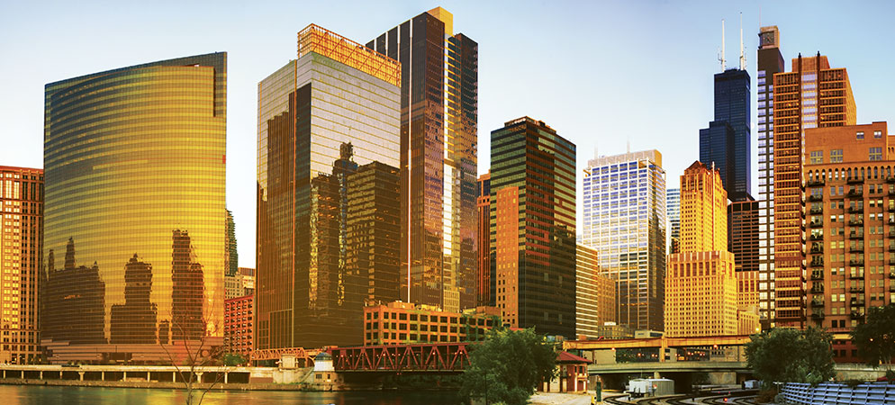 City skyline with modern skyscrapers at sunset, downtown urban architecture and business district landscape view