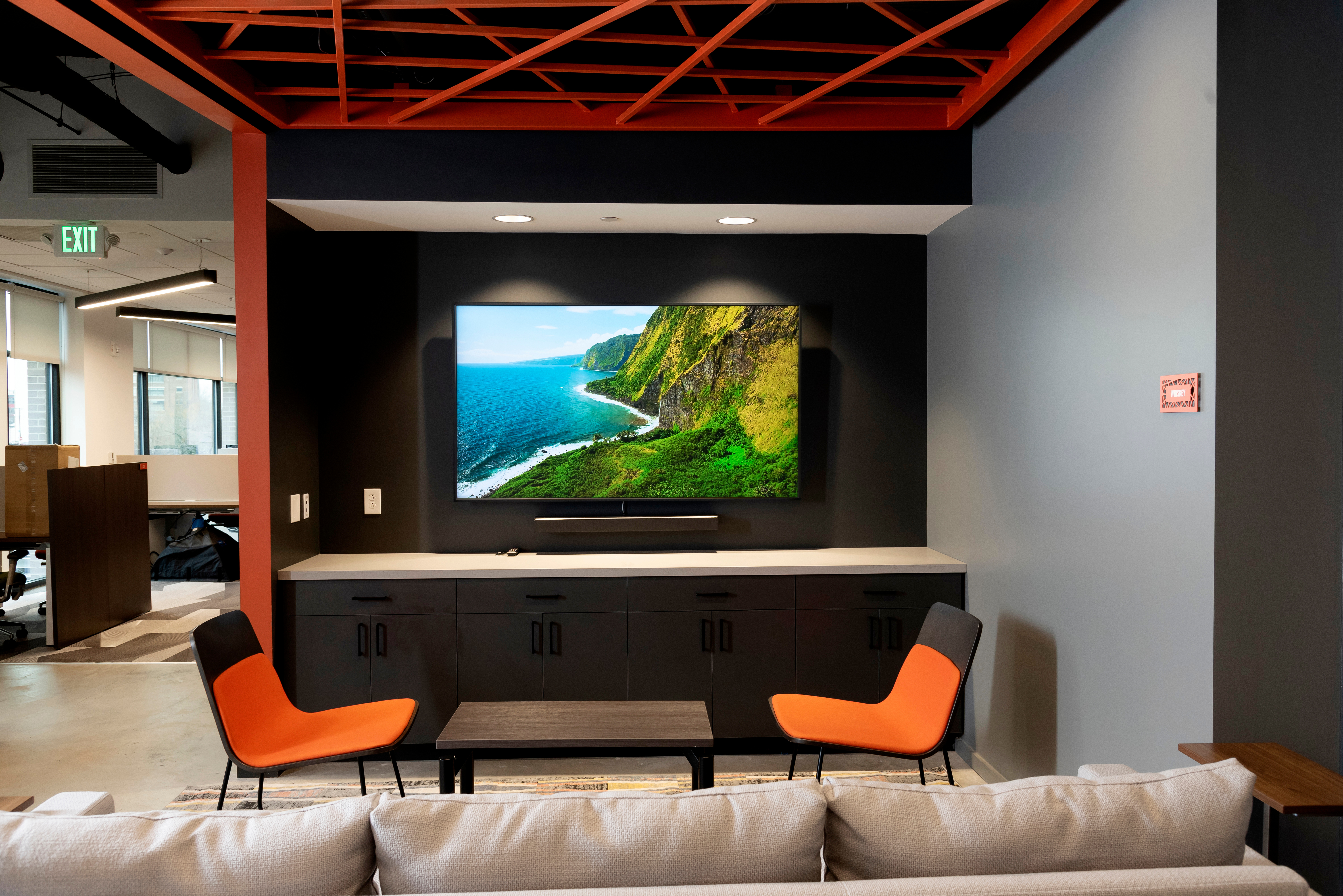 Screen with chairs and a lounge area