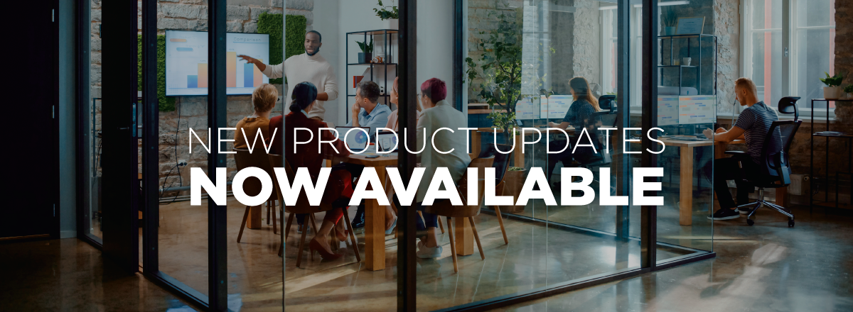 New product updates now available banner showing team meeting in modern glass-walled office conference room