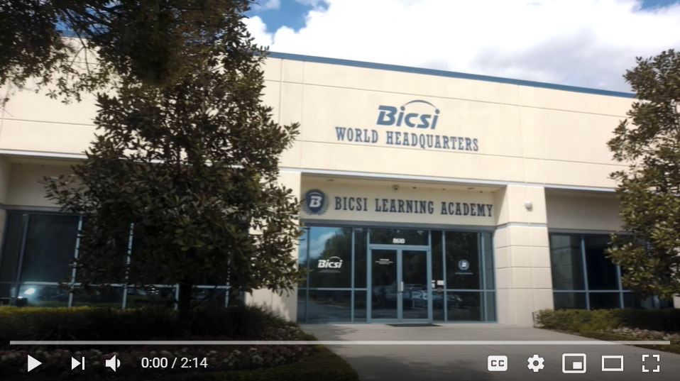 BICSI World Headquarters and BICSI Learning Academy building exterior with glass entrance