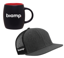 Biamp branded merchandise including black coffee mug and dark gray mesh-back baseball cap