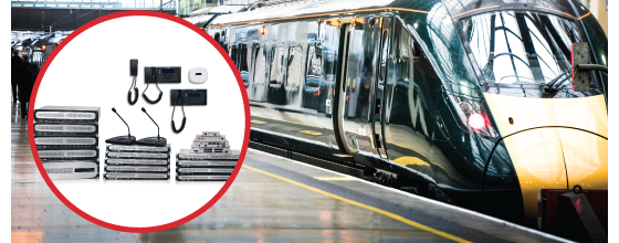 Biamp public address and intercom systems shown beside modern train at busy railway station