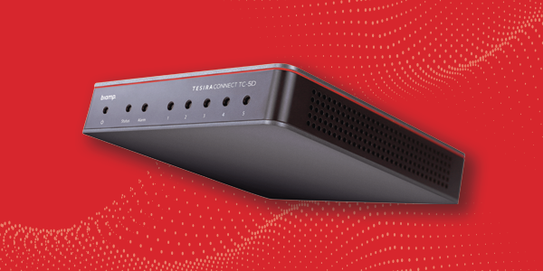 Biamp TesiraCONNECT TC‑5D conferencing network hub for AVB and Dante connections on red background