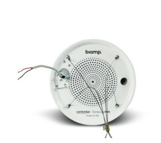The back of a white, round Biamp sound masking speaker, showing the grille and wiring for installation.