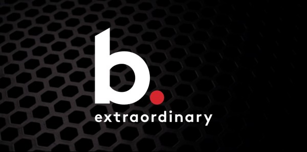Biamp b. extraordinary logo over dark speaker grille background