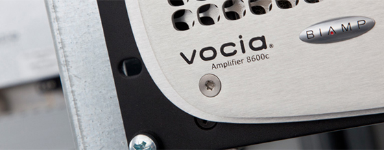 Close-up of a Biamp Vocia 8600c amplifier front panel mounted in a rack.