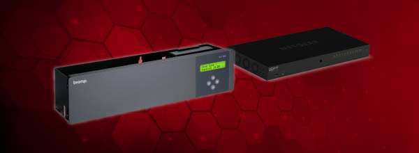 Biamp QT X sound masking processor and NETGEAR AV network switch shown together, highlighting integrated networked acoustic privacy solutions.