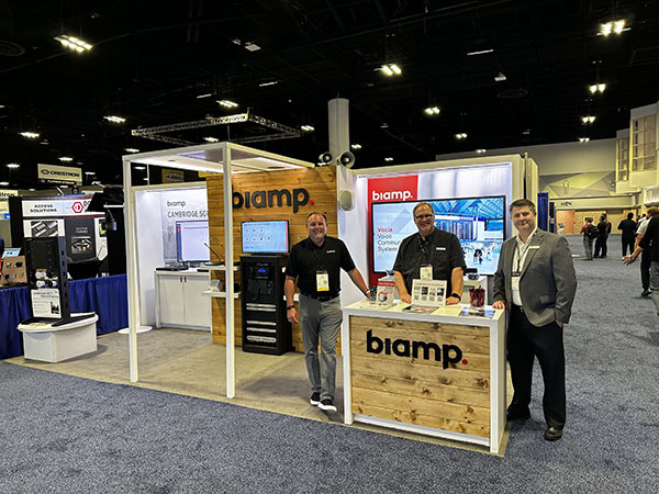 Biamp trade show booth with staff representatives ready to discuss professional audio‑visual solutions and demonstrate featured products.