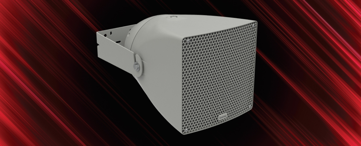 Close‑up of a Biamp white horn loudspeaker mounted on a bracket against a dynamic red streaked background.