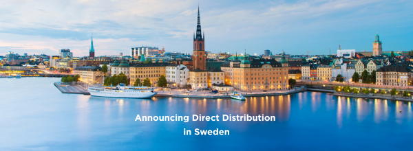 Waterfront view of a Swedish city skyline by the water with a banner reading 'Announcing Direct Distribution in Sweden'.