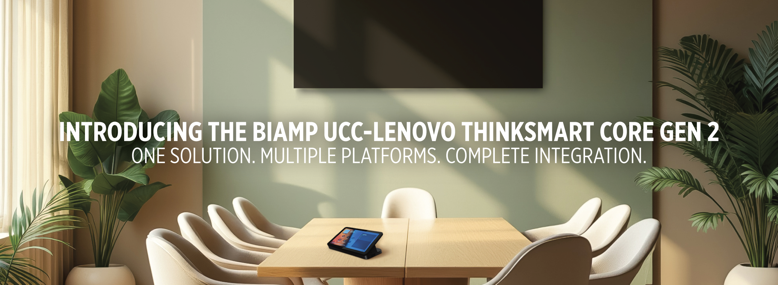 Conference room with tabletop touch controller and text: “Introducing the Biamp UCC–Lenovo ThinkSmart Core Gen 2 – One solution. Multiple platforms. Complete integration.”