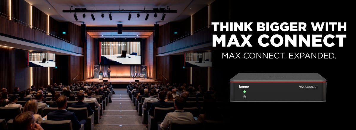 Max Connect expanded for large auditoriums, shown with presentation venue, audience, and Biamp conference device banner