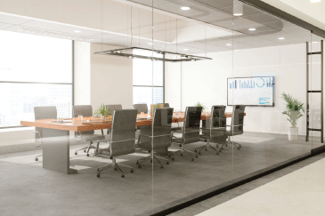 conferencing room with a boardroom table and seats sitting around it