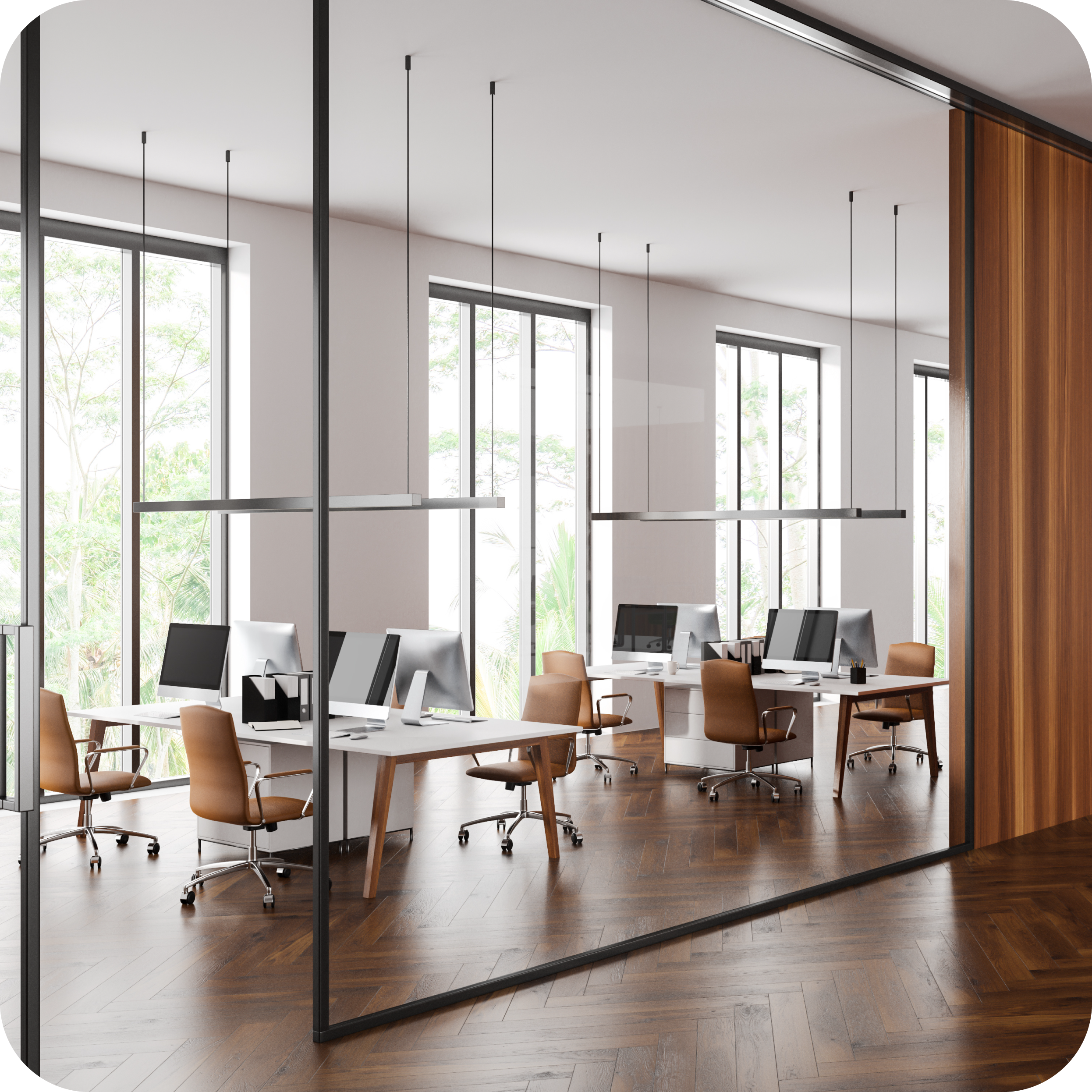 Image of an empty open plan office next to bright windows.